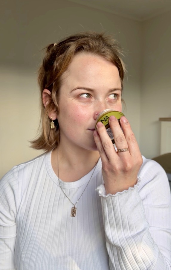 A woman smelling Reviana cream; product photograph separate from Judy’s review